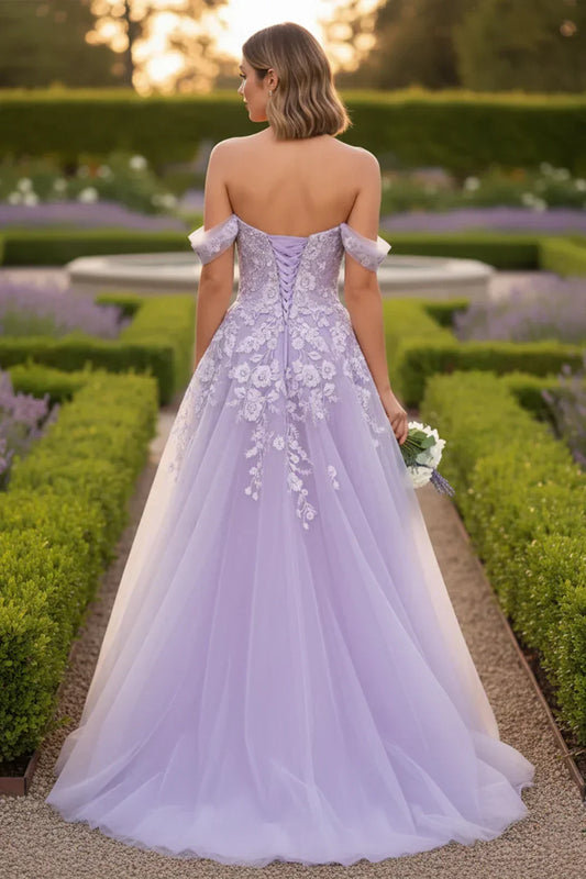 Back view of Sevoba lavender lace-up corset evening gown showing a voluminous tulle skirt and floral details, garden background