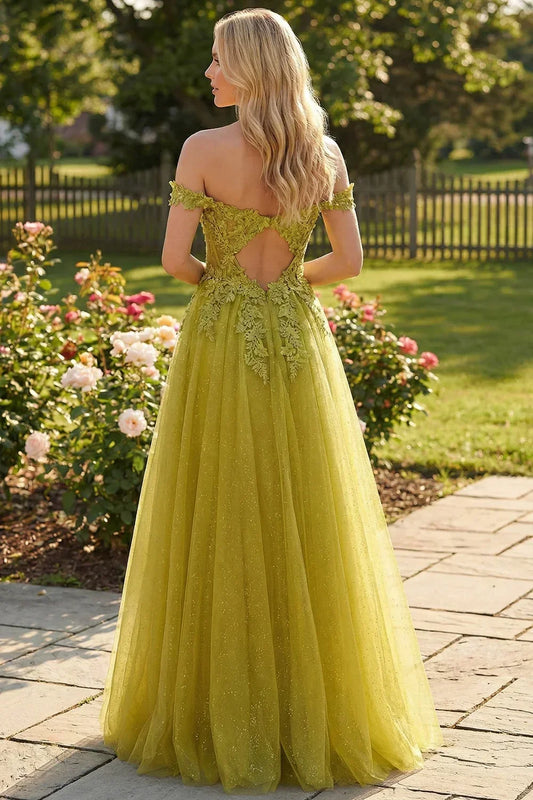Back view of Sevoba lime green fairy evening gown showing a unique keyhole open back design with floral lace details, garden fence background