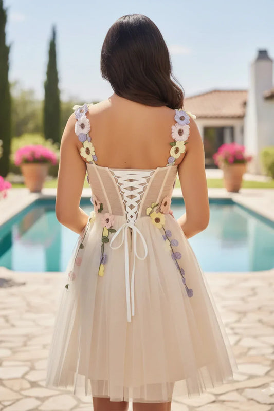 Back view of short tulle prom dress with 3D floral appliqué outdoor by pool