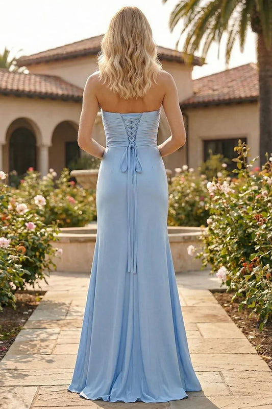 Back view of Sevoba light blue satin evening gown showing a lace-up corset back and ruched bodice, garden background