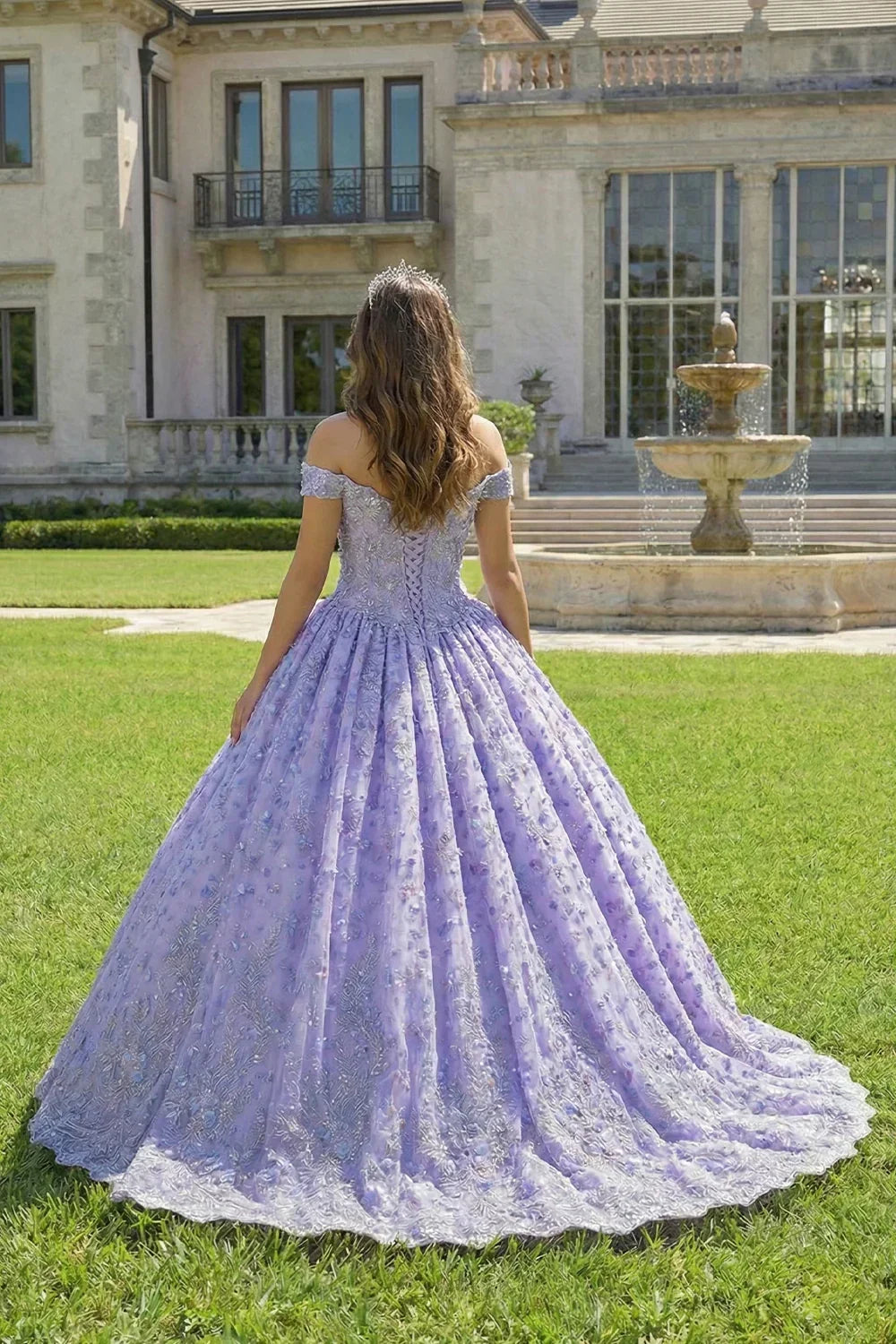 Lavender ball gown with off-shoulder sleeves and floral embroidery in a garden setting