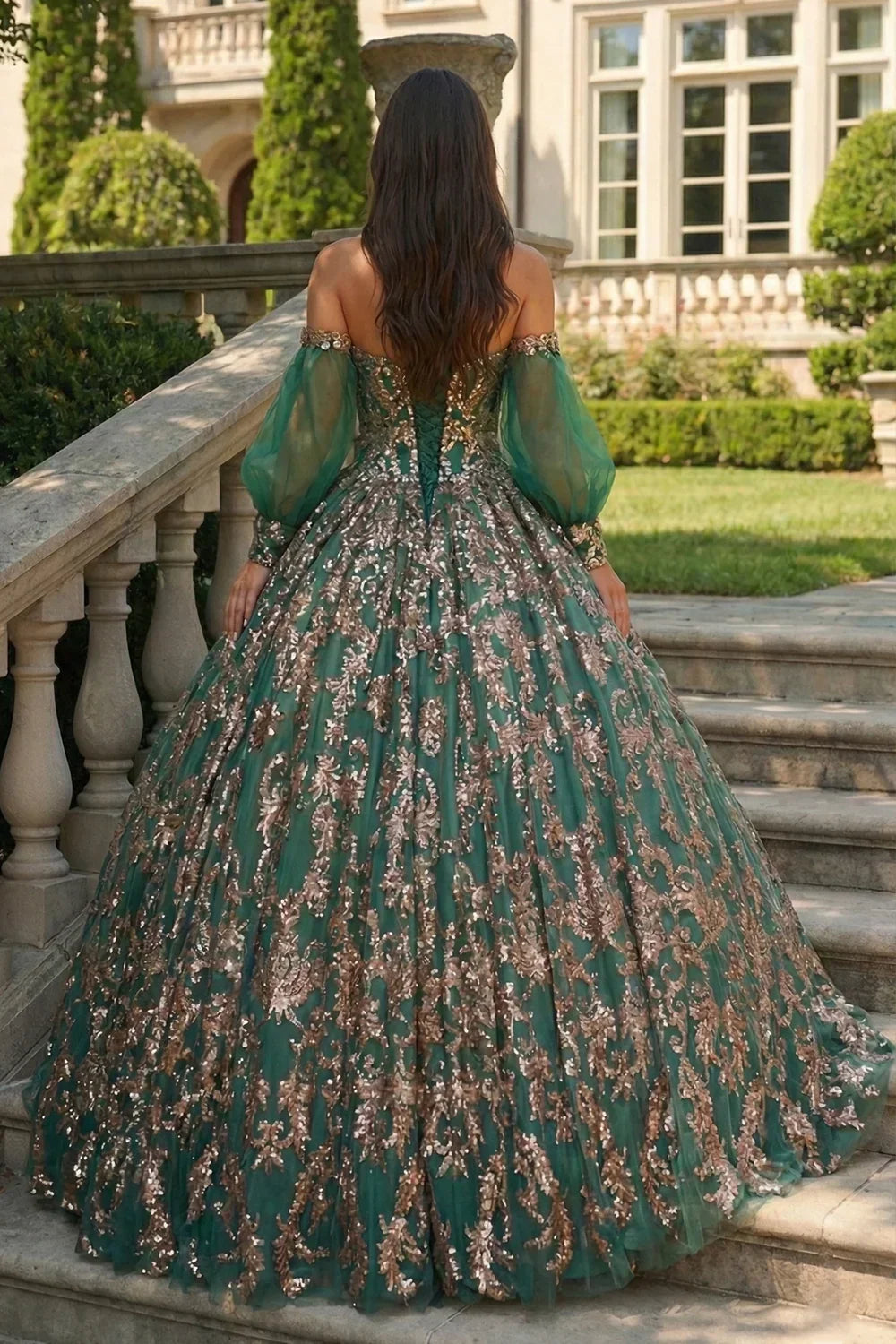 Green glittery ball gown with sheer sleeves and gold sequin details, outdoor setting