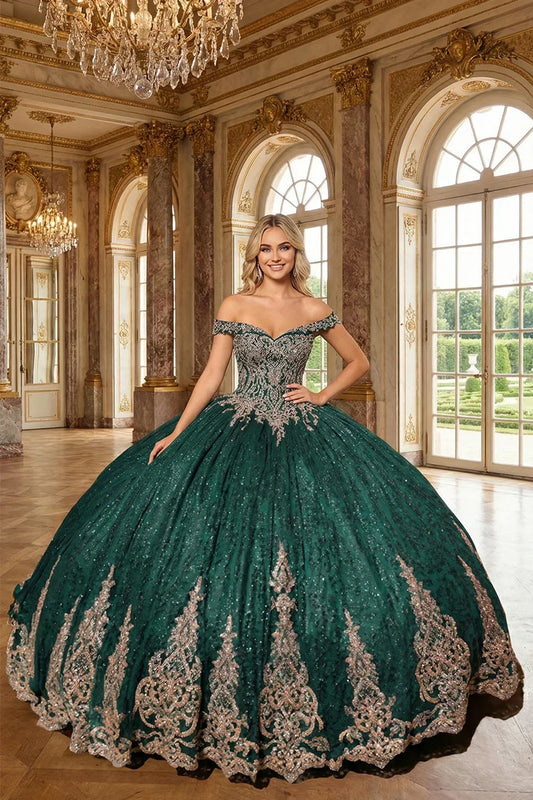 Emerald off-the-shoulder ball gown with lace and glitter details in a grand ballroom.