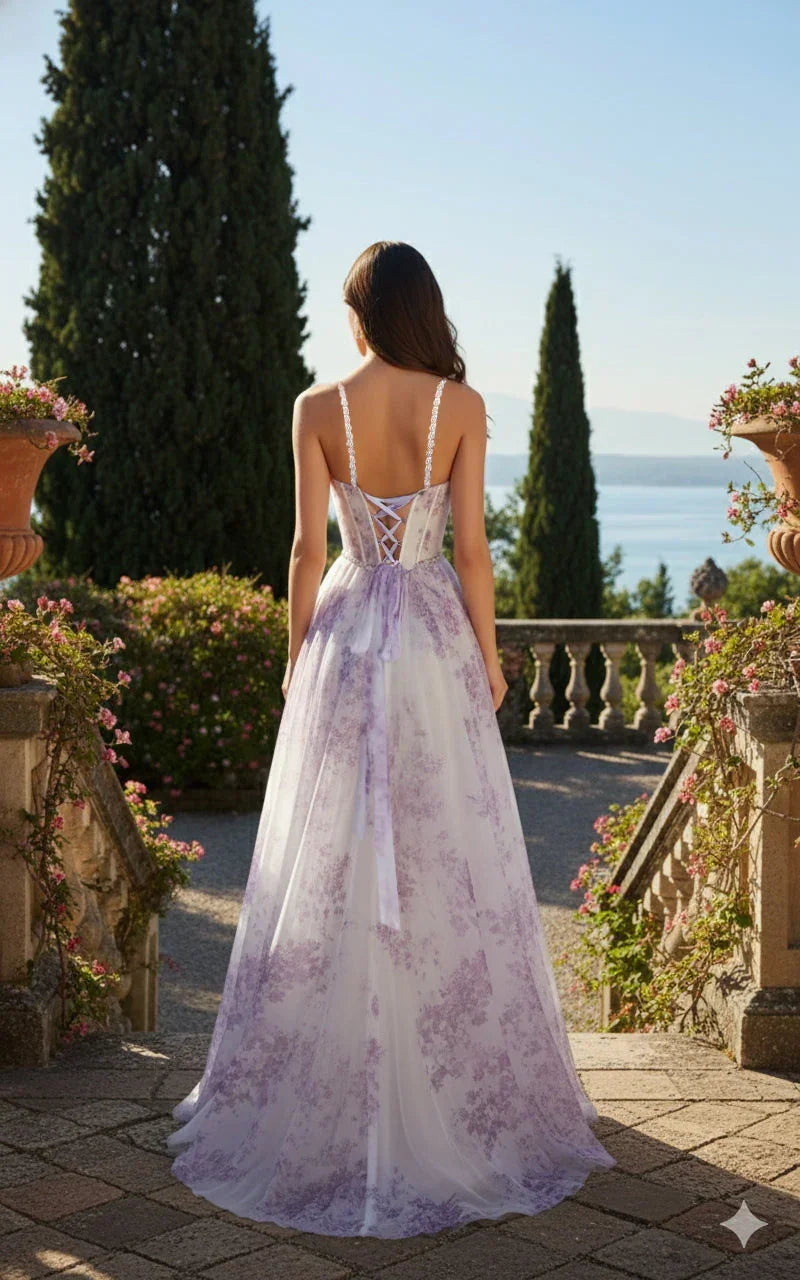 Woman in a long lilac floral A-line prom dress with lace-up back outdoors in a garden setting