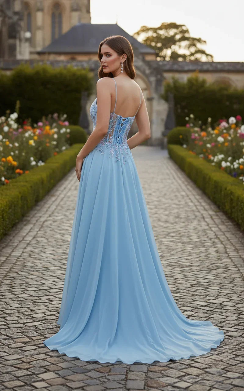Woman in a blue glitter A-line prom dress with spaghetti straps and tulle skirt outdoors