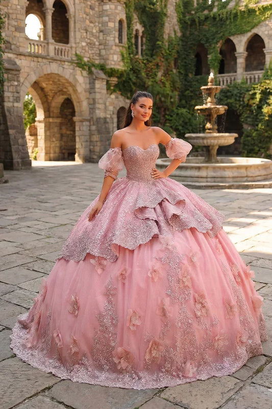 Pink textured ruffle ball gown with 3D floral embroidery and off-shoulder sleeves outdoors