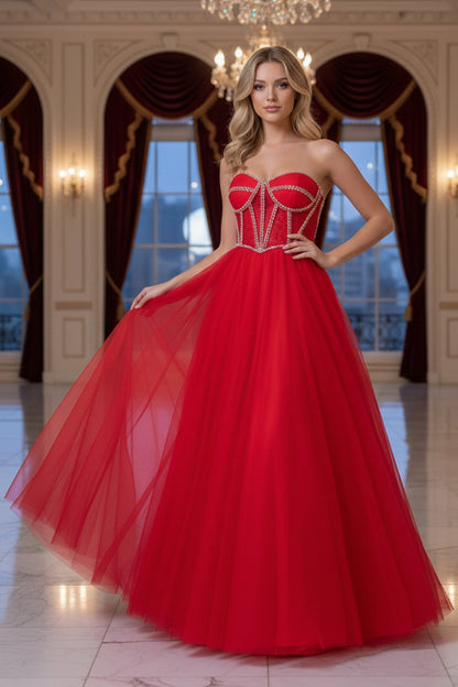 Sevoba strapless red tulle prom dress featuring a structured corset bodice with rhinestone embellished boning, front view in ballroom