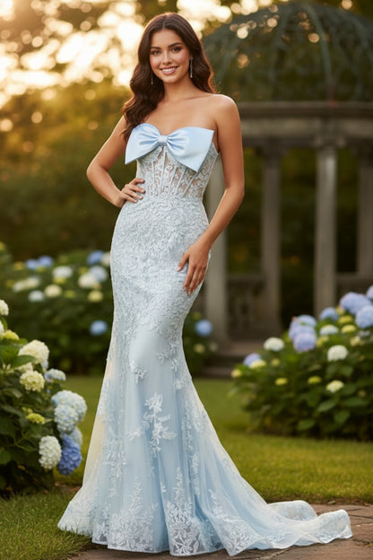 Sevoba bow-front strapless lace corset mermaid prom dress with lace appliqués and floor-length sweep, front view in garden at golden hour