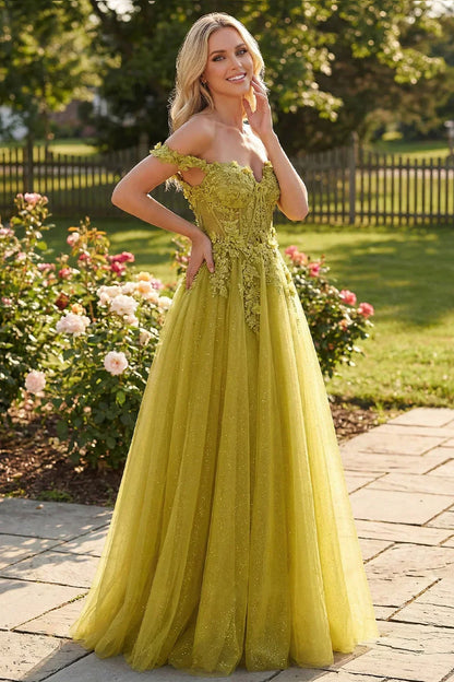 Sevoba chartreuse green glitter tulle prom dress featuring off-the-shoulder floral lace straps and a corset bodice, front view in sunny garden setting