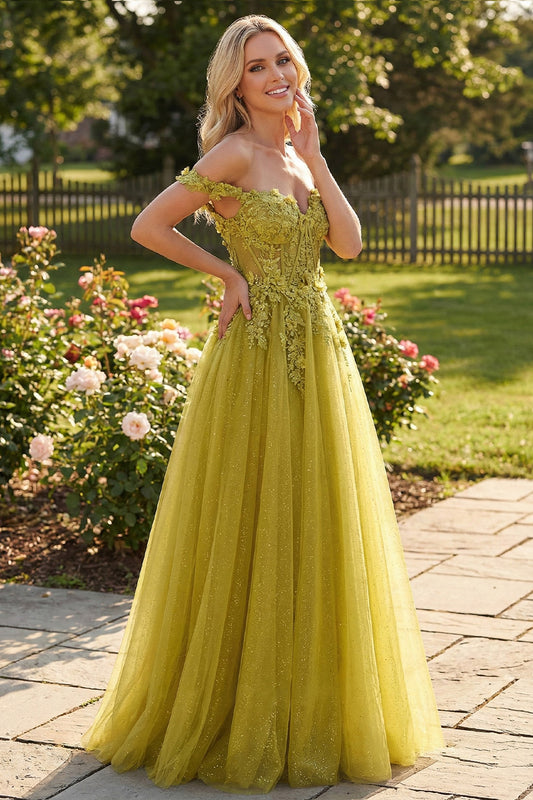 Sevoba chartreuse green glitter tulle prom dress featuring off-the-shoulder floral lace straps and a corset bodice, front view in sunny garden setting