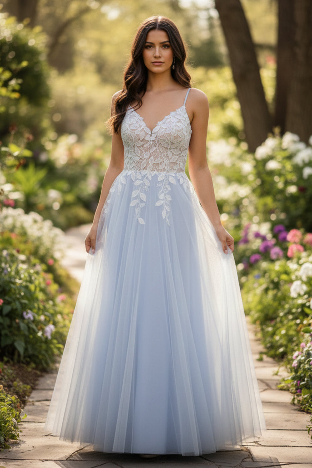 Sevoba light blue tulle A-line prom dress featuring white floral lace appliqués and spaghetti straps, front view in garden setting