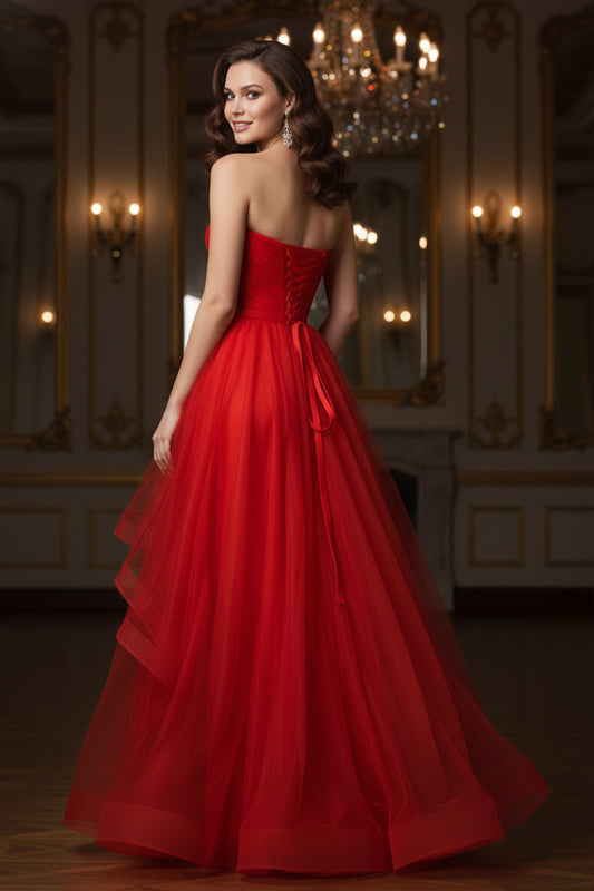 Back view of Sevoba red tulle A-line evening gown showing a lace-up corset back and voluminous floor-length skirt