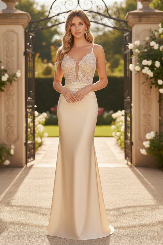 Sevoba champagne satin sheath prom dress featuring a floral lace applique bodice, deep V-neckline, and spaghetti straps, front view in outdoor garden gate setting.