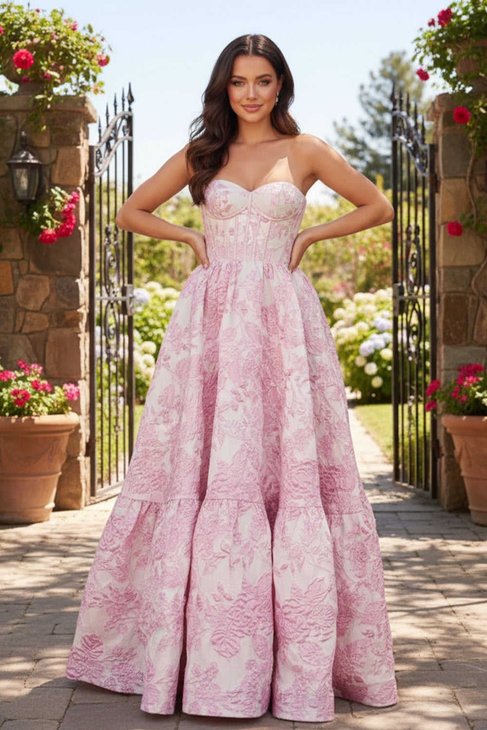 Sevoba pink strapless sweetheart corset floral ball gown prom dress, front view in garden gate setting