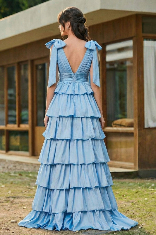 Back view of Sevoba black and white floral tulle prom dress showing a low back and zipper closure, street setting