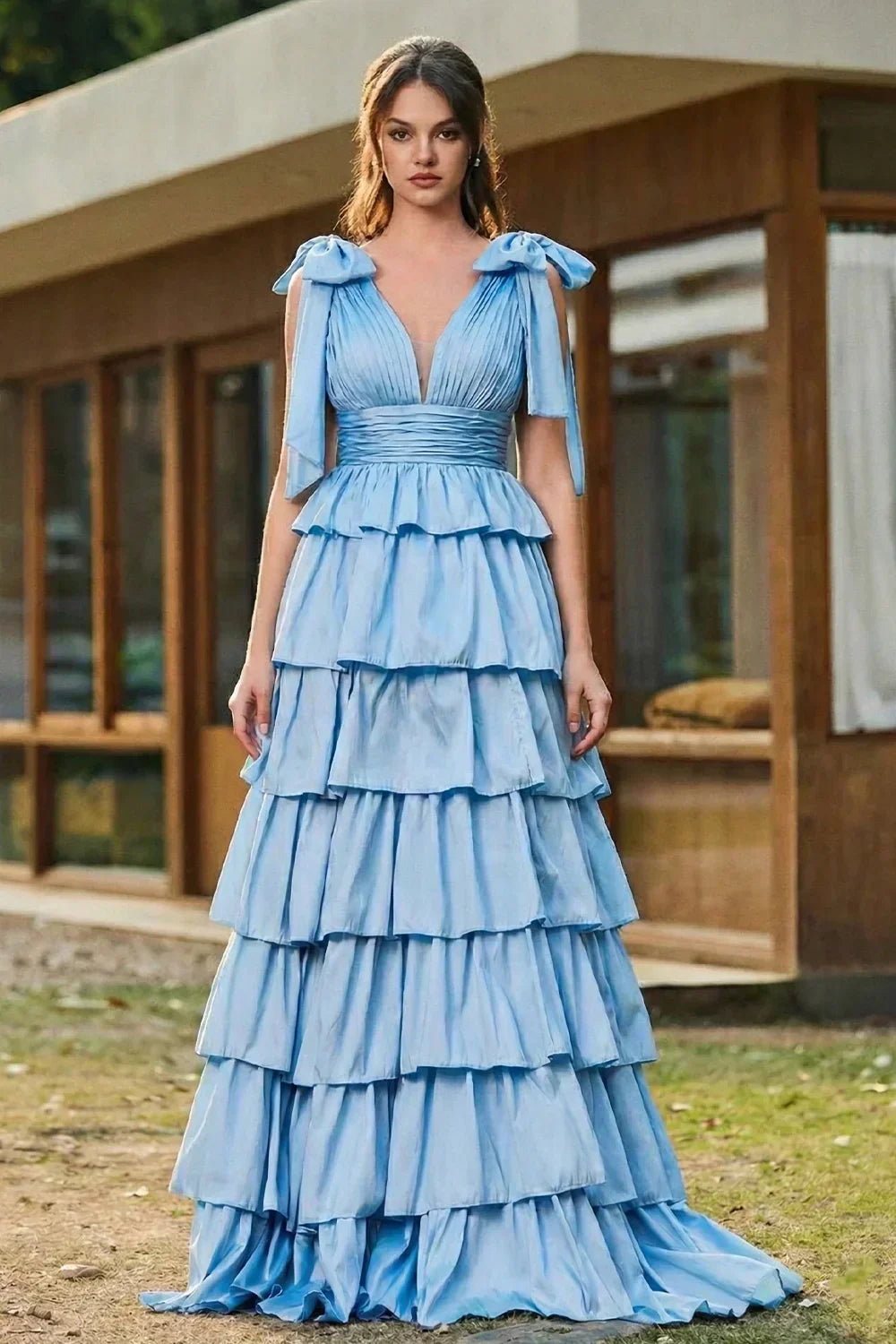 Sevoba black tulle A-line prom dress featuring white floral embroidery and spaghetti straps, full-length front view on city street