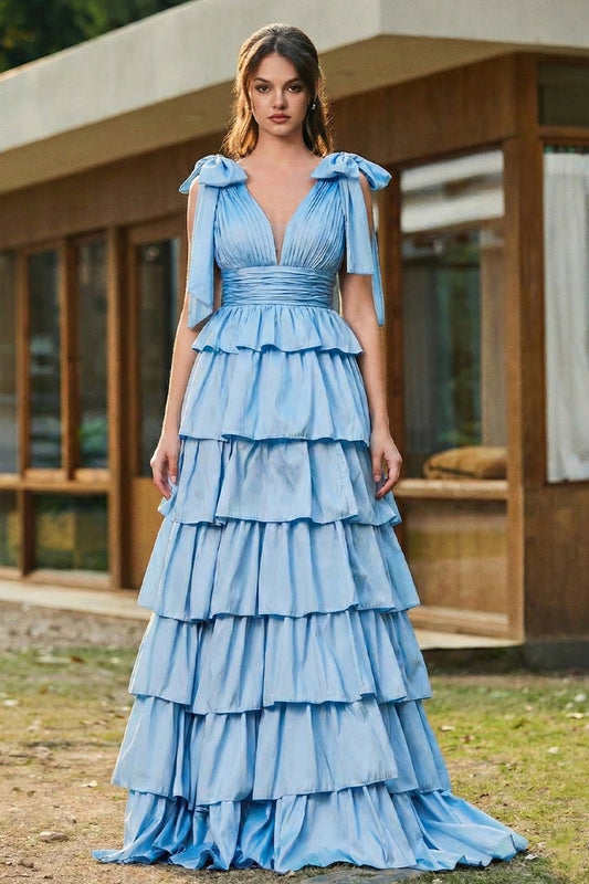 Sevoba black tulle A-line prom dress featuring white floral embroidery and spaghetti straps, full-length front view on city street