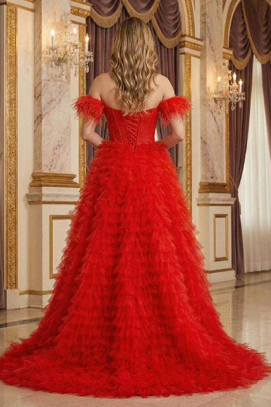 Back view of Sevoba red feather sleeve evening gown showing a lace-up corset back and voluminous textured ruffle skirt, ballroom background