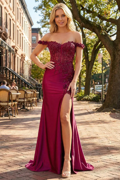 Sevoba burgundy satin prom dress featuring a sheer lace corset bodice, off-the-shoulder floral straps, and high leg slit, front view in city street setting