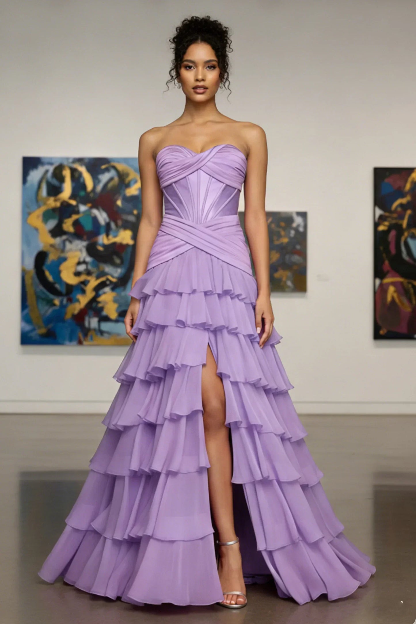 Woman in strapless lilac tiered evening gown with ruffles and thigh-high slit, standing in art gallery