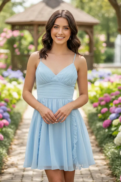 Woman wearing a light blue A-line deep V-neck ruched short homecoming dress in a garden