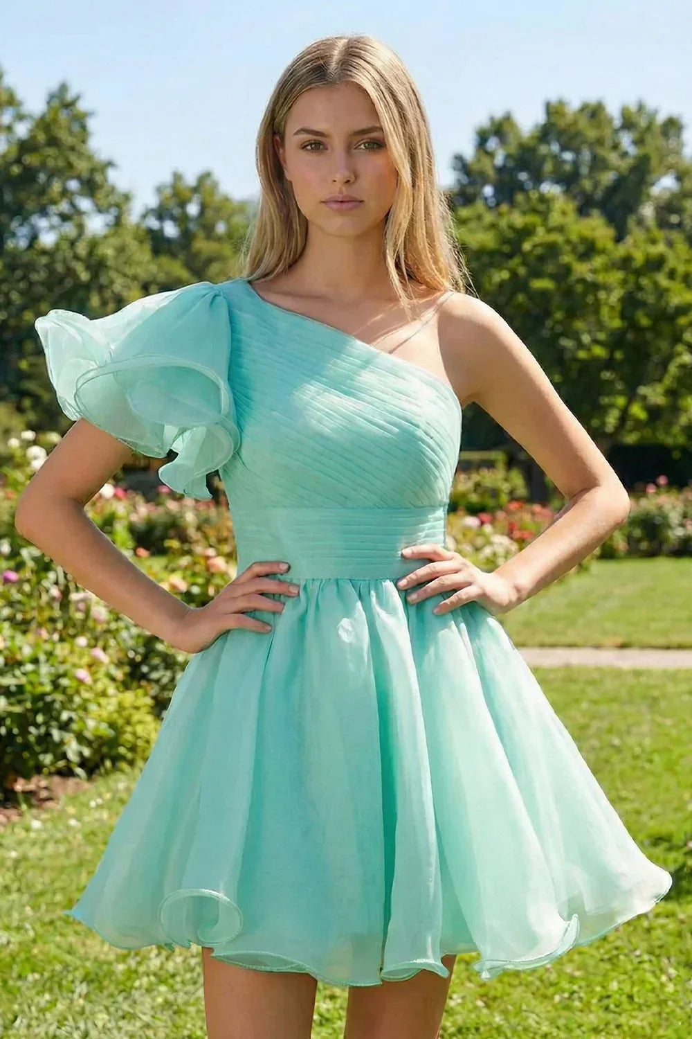 A-line one shoulder ruffled sleeve mint green homecoming dress with pleats, outdoor setting