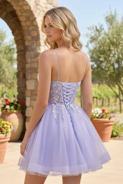 Light purple sequin tulle homecoming dress with corset back and floral appliques outdoors