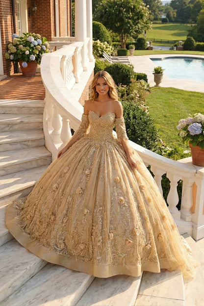 Elegant off-the-shoulder gold tulle A-line ball gown with 3D floral details, worn outdoors