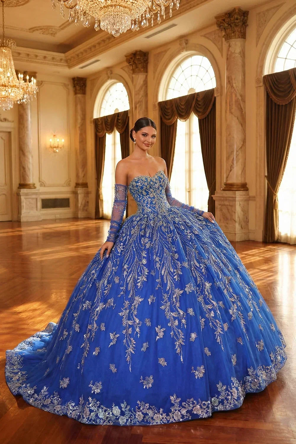 Blue glittery ball gown with cold shoulder and sheer sleeves in elegant ballroom setting