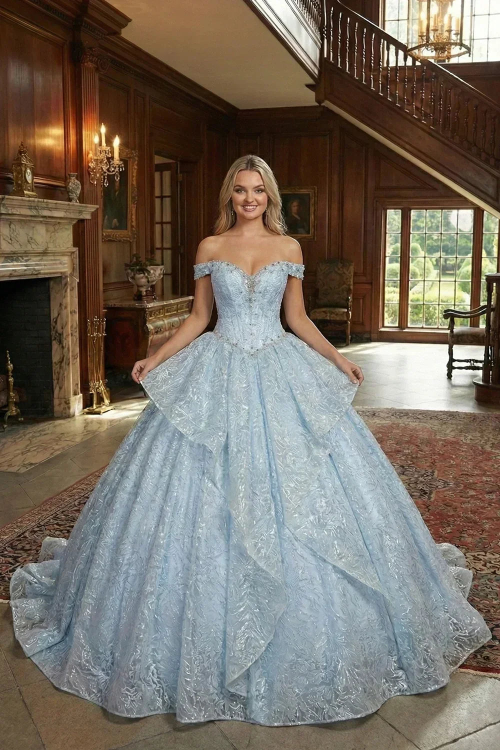 Light blue layered ruffled ball gown with off-shoulder design and embroidery, worn in an elegant mansion setting.