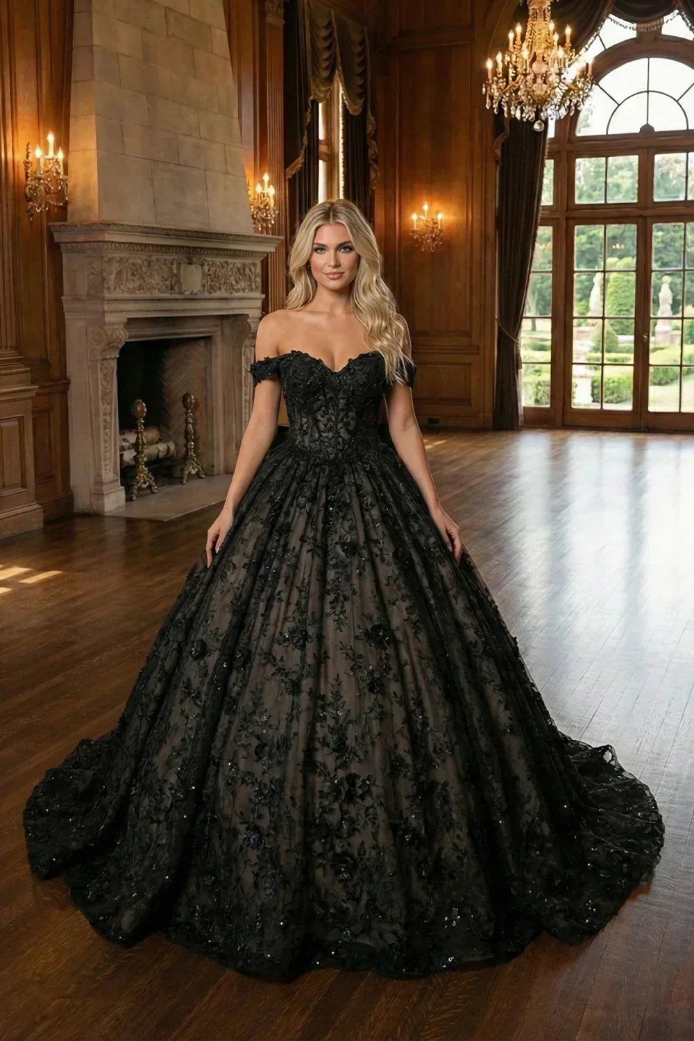 Woman in black off-shoulder ball gown with 3D floral details in elegant ballroom
