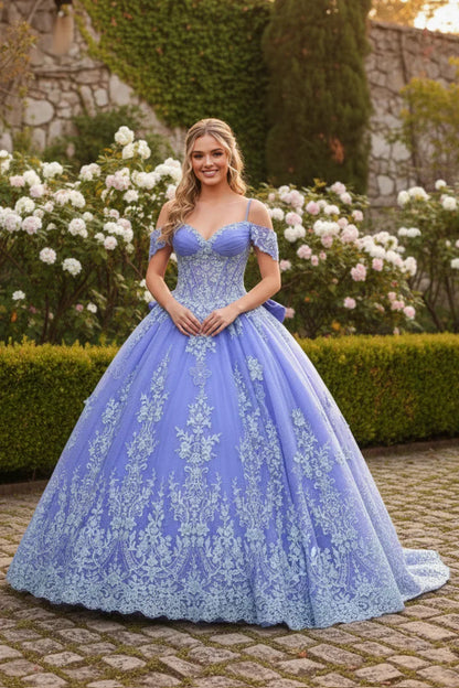 Elegant lavender ball gown quinceañera dress with floral embroidery in a garden