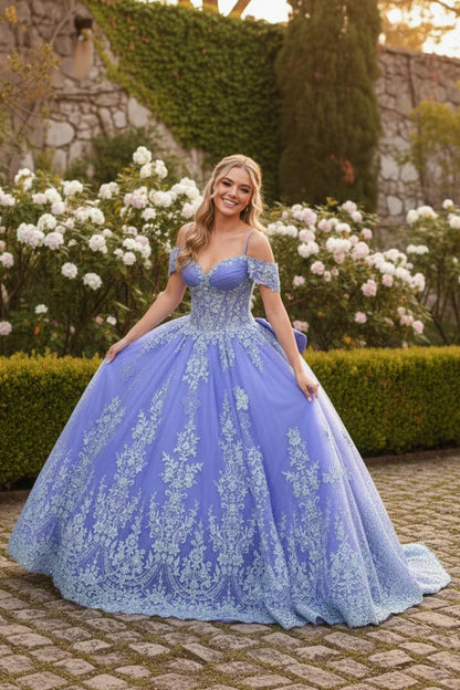 Lavender ball gown with off-the-shoulder straps and floral embroidery, worn outdoors in a garden.