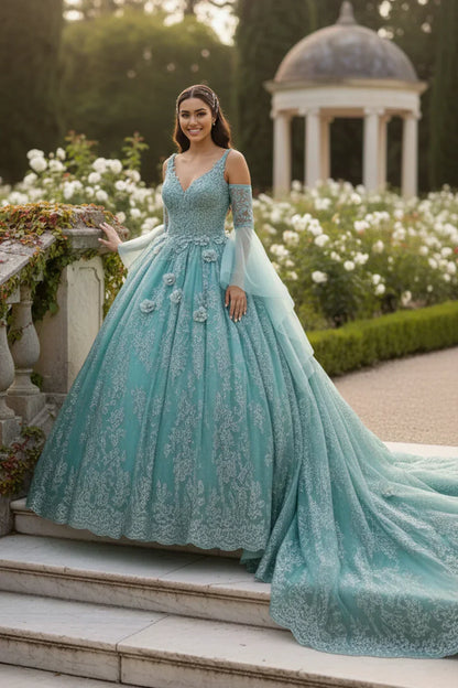 Elegant aqua blue ball gown with floral embroidery, cold shoulder sleeves, and train in a garden.