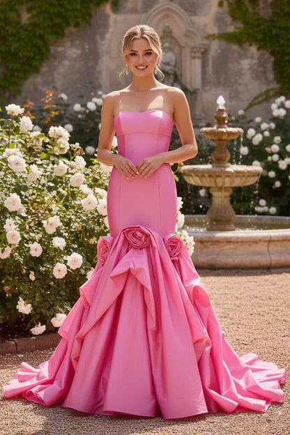Sevoba strapless rosette mermaid prom dress with dramatic train and bold 3D rosettes, front view in courtyard garden